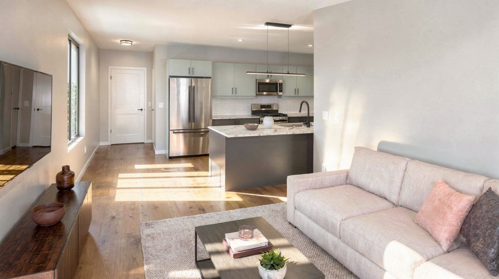 Forest Edge Place living room and kitchen combo with light hardwood flooring