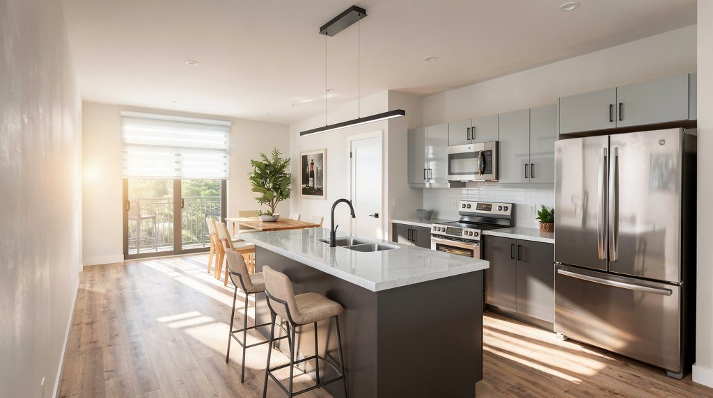 Forest Edge Place kitchen with dark cabinetry and island seating