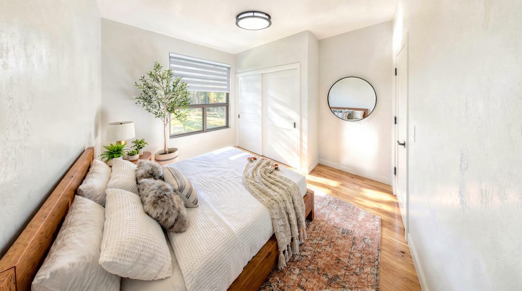 Forest Edge Place bedroom with natural light and neutral décor