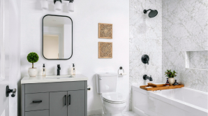 Forest Edge Place bathroom with tiled shower surround, soaker tub, grey vanity, and matte black fixtures